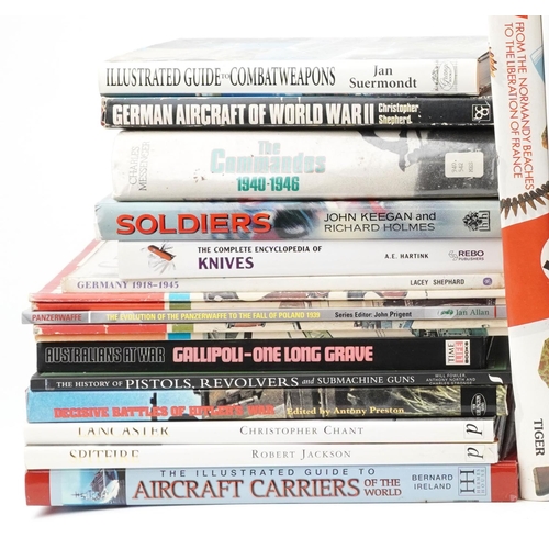 2612 - A large collection of military interest books and collector's reference books including The Commando... 