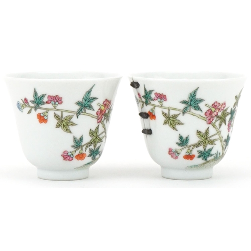 251 - Pair of Chinese porcelain tea bowls hand painted with flowers, six figure character mark to the base... 