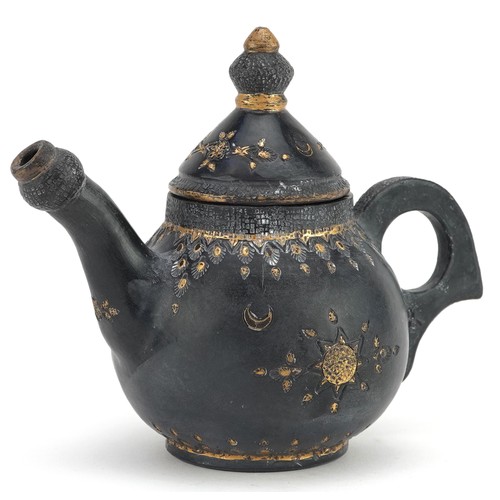 52 - An Islamic Bukhara copper water jug engraved with floral motifs, 24cm high.