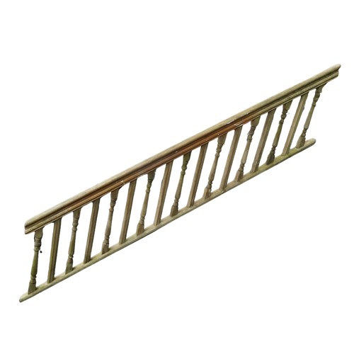 1131 - A 19th century teak stair banister, the moulded rail raised on alternating turned and moulded suppor... 