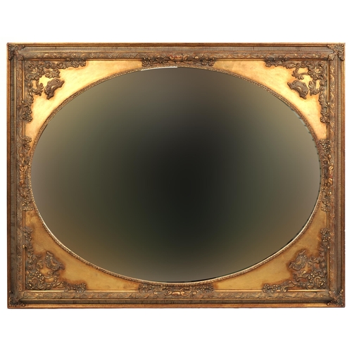 1139 - A modern rectangular gilt wall mirror with oval inset glass, 92cm x 117cm.