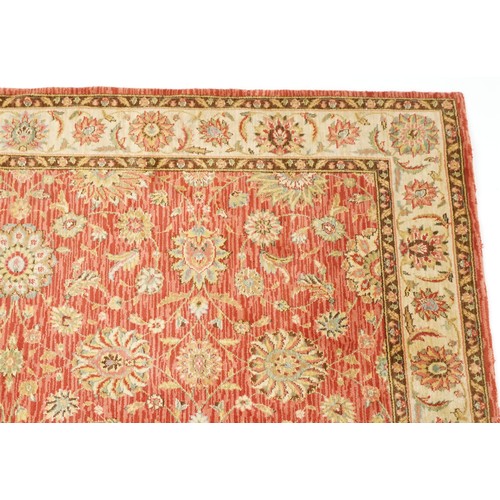 1095 - A late 20th century machine made carpet decorated with floral sprays, 252cm x 167cm, together with a... 