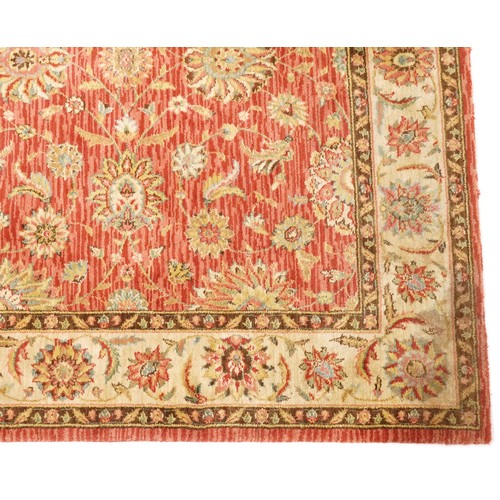 1095 - A late 20th century machine made carpet decorated with floral sprays, 252cm x 167cm, together with a... 