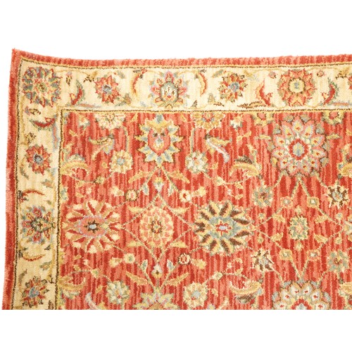 1095 - A late 20th century machine made carpet decorated with floral sprays, 252cm x 167cm, together with a... 