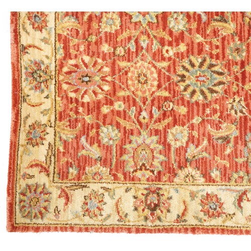 1095 - A late 20th century machine made carpet decorated with floral sprays, 252cm x 167cm, together with a... 