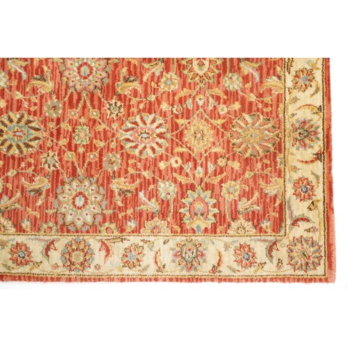 1095 - A late 20th century machine made carpet decorated with floral sprays, 252cm x 167cm, together with a... 