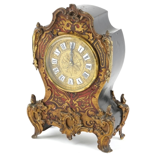 A 19th century French tortoiseshell and boulle work mantle clock with gilt metal mounts, the circular gilt dial with black Roman numerals, raised on scroll feet, 24cm high x 15cm wide.