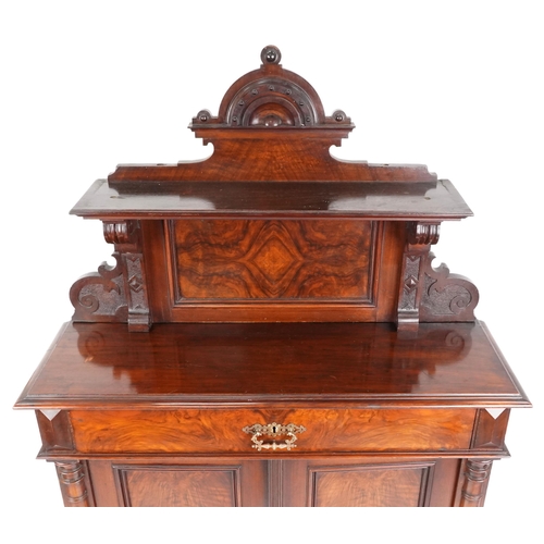 1006 - A Victorian walnut narrow chiffoniere, the shelf back above a drawer and a pair of panel doors, 193c... 