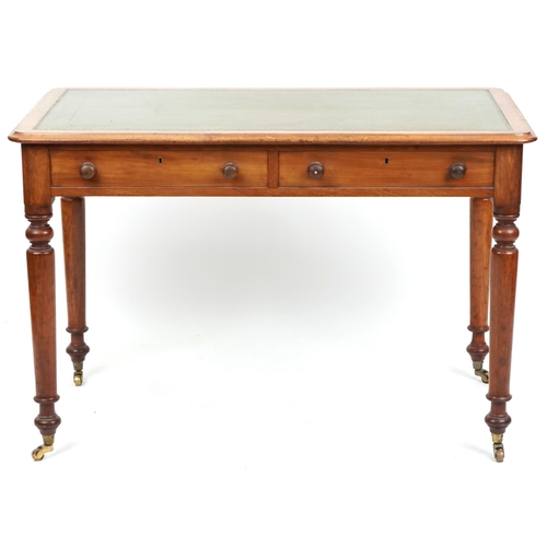 1005 - A late Victorian mahogany writing table, the top inset with a green gilt tooled leather writing surf... 