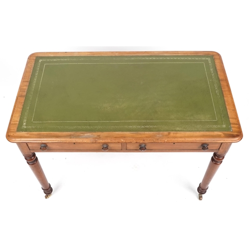 1005 - A late Victorian mahogany writing table, the top inset with a green gilt tooled leather writing surf... 