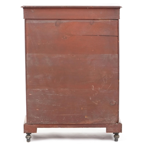 1052 - A mid Victorian walnut pier cabinet with gilt metal mounts and glazed panel door, raised on turned f... 