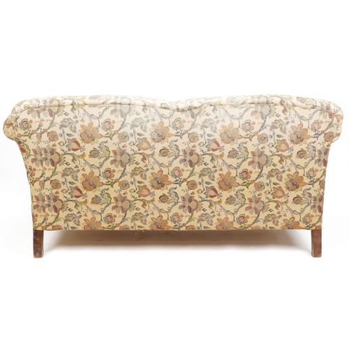  A late Victorian drop end two seat settee upholstered in floral damask, raised on cabriole legs, 88c... 