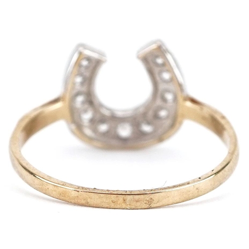 157 - A 9ct gold horseshoe ring set with clear stones, size S, 2.3g