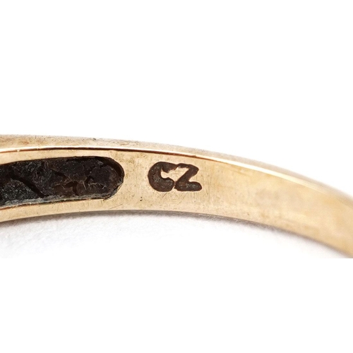 394 - A 9ct gold garnet and cubic zirconia half eternity ring, size R, 2.3g.