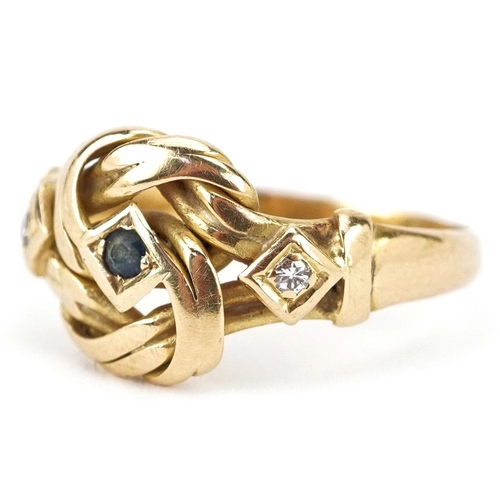  An 18ct gold knot design ring set with a central sapphire and two diamonds, indistinct hallmarks, si... 