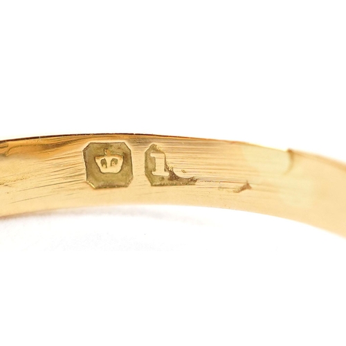  An 18ct gold knot design ring set with a central sapphire and two diamonds, indistinct hallmarks, si... 