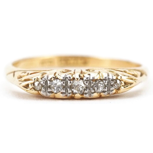 352 - An antique 18ct gold graduated diamond five stone ring with engraved setting, size O, 3.0g.