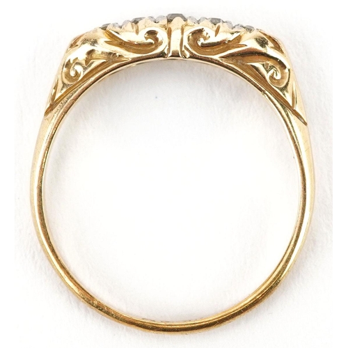 352 - An antique 18ct gold graduated diamond five stone ring with engraved setting, size O, 3.0g.