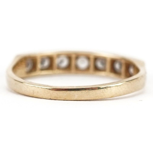 399 - A 9ct gold cubic zirconia half eternity ring set with seven stones, size O, 1.9g.