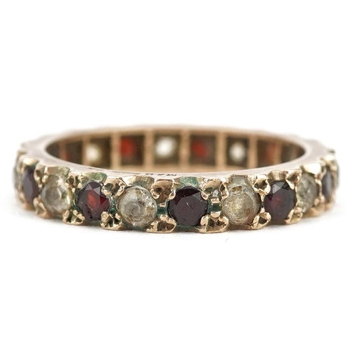 425 - A 9ct gold garnet and clear stone eternity ring, size Q, 3.5g.