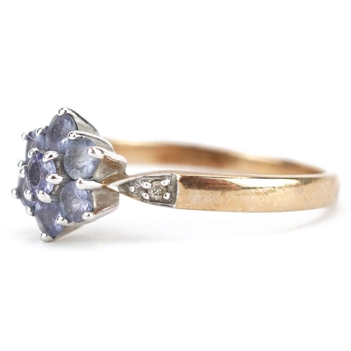  A 9ct gold tanzanite flower head ring with diamond set shoulders, size P, 2.4g.