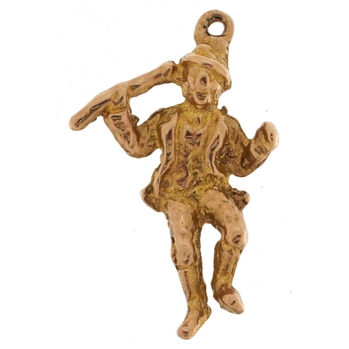 329 - A 9ct gold charm in the form of a jolly gentleman, 2.7cm high, 2.9g.