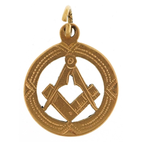 337 - An 18ct gold masonic charm, 2cm high, 2.9g.