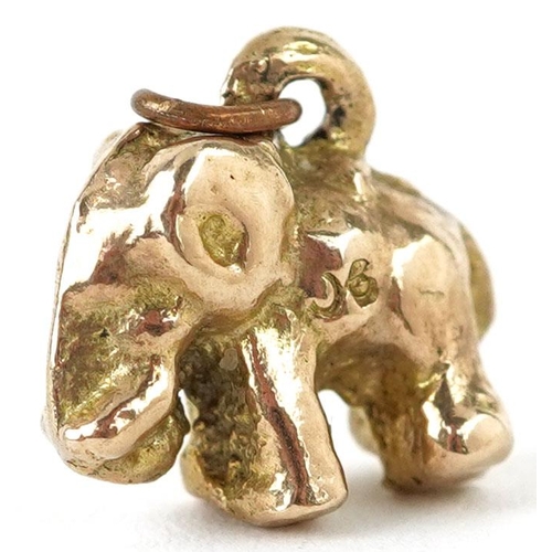 335 - A 9ct gold charm in the form of an elephant, 1.3cm in length, 3.2g.