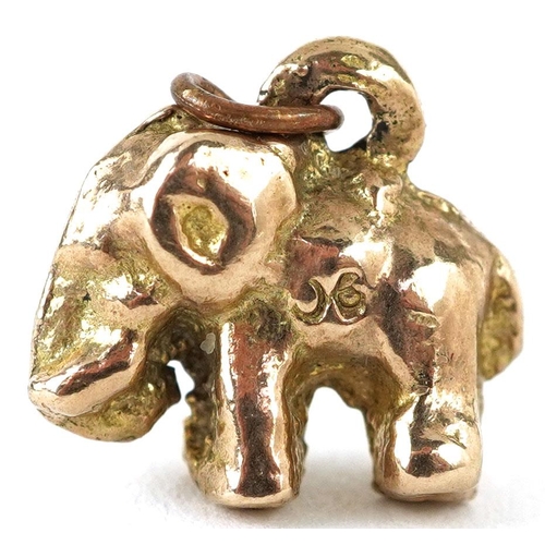 335 - A 9ct gold charm in the form of an elephant, 1.3cm in length, 3.2g.