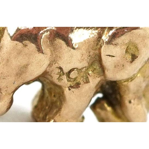 335 - A 9ct gold charm in the form of an elephant, 1.3cm in length, 3.2g.