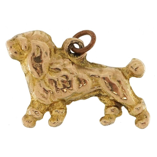 481 - A 9ct gold charm in the form of a Poodle, 1.8cm in length, 3.0g.