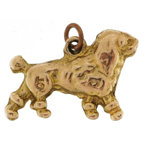 481 - A 9ct gold charm in the form of a Poodle, 1.8cm in length, 3.0g.