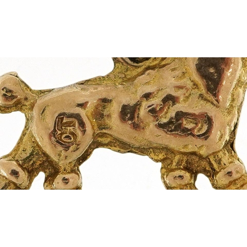 481 - A 9ct gold charm in the form of a Poodle, 1.8cm in length, 3.0g.