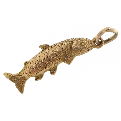 572 - A 9ct gold charm in the form of a trout, 2.3cm in length, 1.7g.