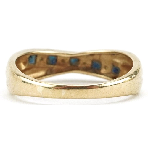 185 - A 9ct gold sapphire and clear stone crossover half eternity ring, size R, 2.9g.