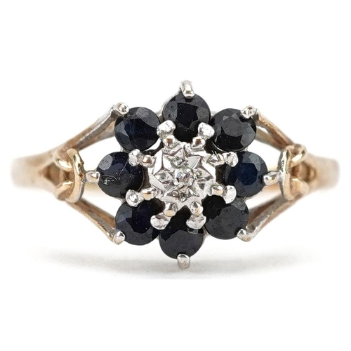 299 - A 9ct gold diamond and sapphire flower head ring, size O, 1.4g.