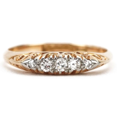 301 - An 18ct gold graduated diamond five stone ring with ornate setting, size K/L, 2.2g.