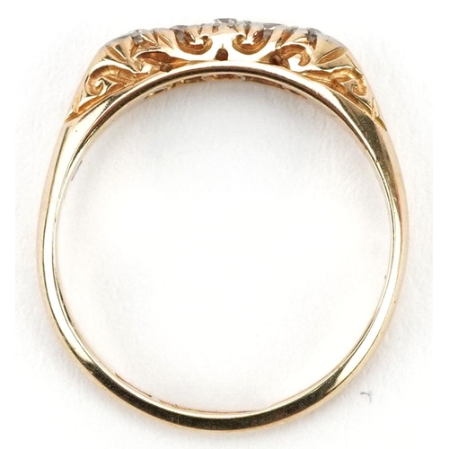 301 - An 18ct gold graduated diamond five stone ring with ornate setting, size K/L, 2.2g.