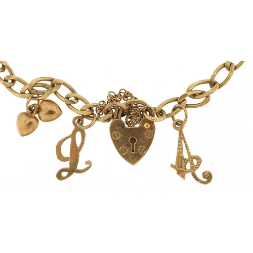  A 9ct gold charm bracelet with a selection of mostly 9ct gold charms and unmarked charms including a... 