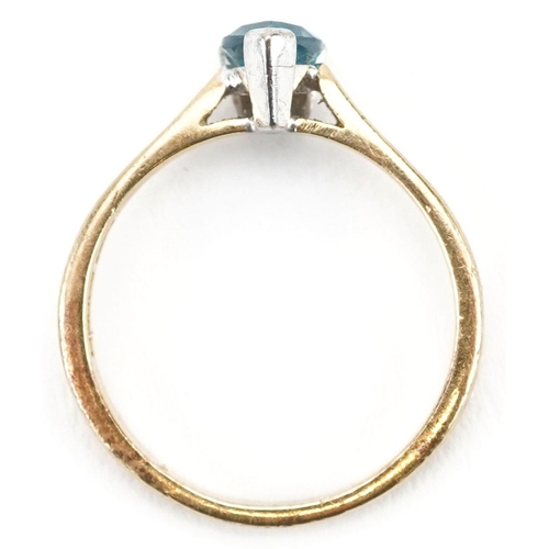 293 - An 18ct gold blue topaz tear drop ring, size P/Q, 3.6g.