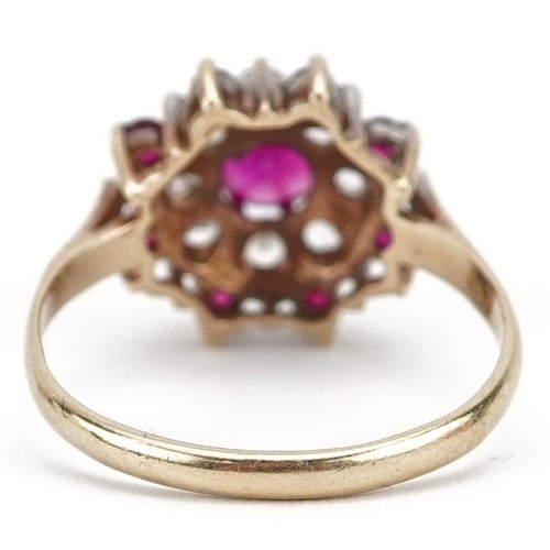 226 - A 9ct gold pink topaz and clear stone three tier flower head ring, size P, 2.7g.