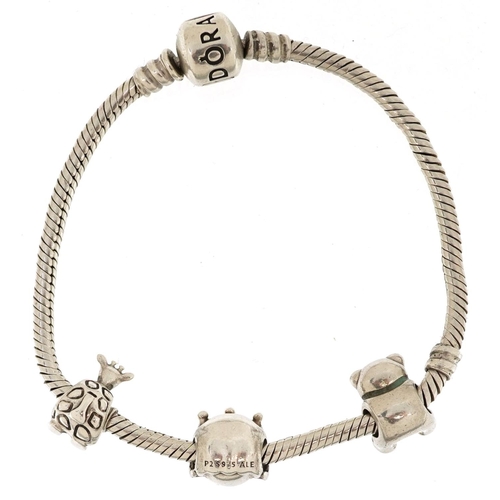  A Pandora silver charm bracelet with three charms, 18cm in length, 23.7g, with box.