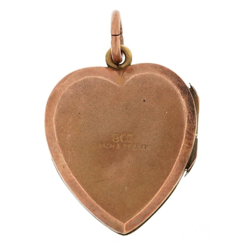 356 - A 9ct gold back and front love heart locket set with a diamond, 2.2cm high, 4.5g.