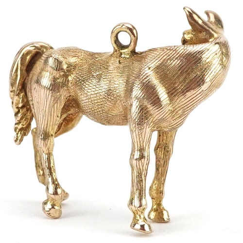  A large 9ct gold charm in the form of a horse, 2.3cm high, 7.8g.