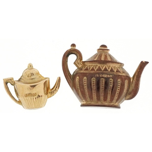 382 - Two 9ct gold charms in the form of teapots, the largest 2.4cm wide, total 2.8g.