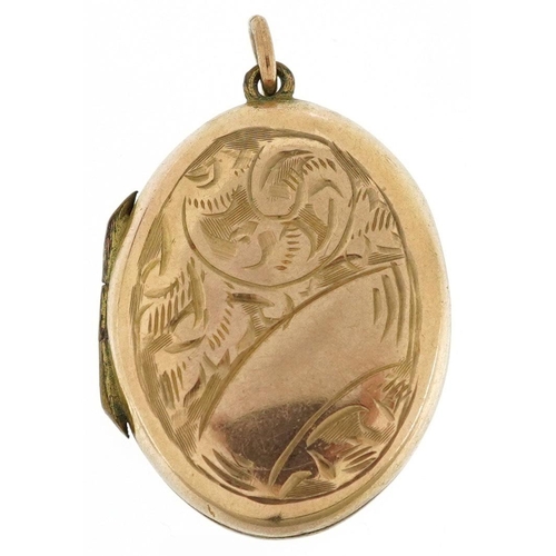 317 - A 9ct gold back and front floral engraved locket, 2.4cm high, 3.6g.