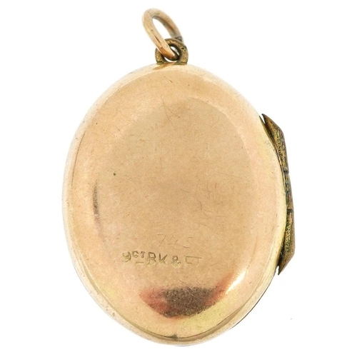 317 - A 9ct gold back and front floral engraved locket, 2.4cm high, 3.6g.