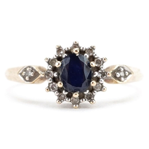 365 - A 9ct gold sapphire and diamond cluster ring with diamond set shoulders, size M, 1.8g.