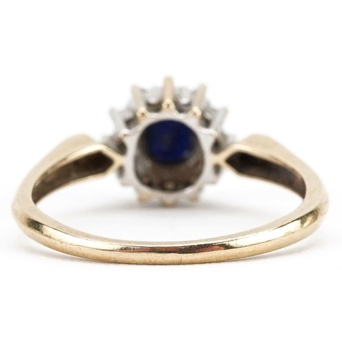 365 - A 9ct gold sapphire and diamond cluster ring with diamond set shoulders, size M, 1.8g.