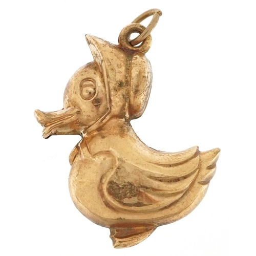 353 - A 9ct gold charm in the form of a comical duck wearing a hat, 2.3cm high, 1.3g